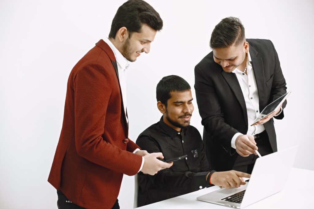 three-men-discussing-ideas-white-wall-indian-nationality (1)