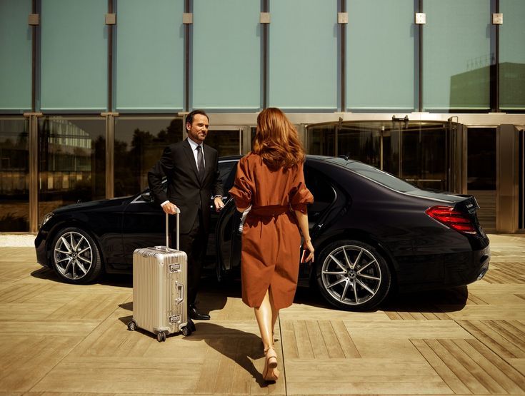 girls Walk For Sitting in chauffeurs Service Car And Driver Steering At her