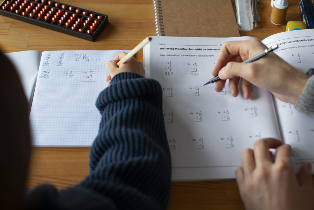 high-angle-girl-learning-math-school