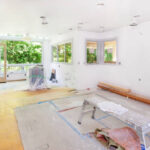 Walls and trim sprayed - recessed cans and light still wrapped and taped